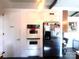 A galley kitchen featuring a stainless steel refrigerator and double oven at 2535 Fairfax Dr, Gastonia, NC 28054