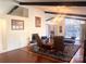 Bright living room boasting a fireplace, vaulted ceilings, a chandelier, and large windows offering natural light at 2535 Fairfax Dr, Gastonia, NC 28054