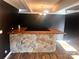 The home features an entertainment area with unique stone wet bar and rustic wood countertop at 2535 Fairfax Dr, Gastonia, NC 28054