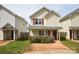 Two-story house with a red door and landscaped lawn at 1020 Beaugard Dr, Charlotte, NC 28208