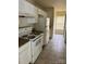 White kitchen with granite countertops and stove at 1020 Beaugard Dr, Charlotte, NC 28208