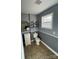 Well-lit bathroom with a toilet, window, and a vanity at 1491 Hwy 160 E Rd, Fort Mill, SC 29715
