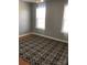 Bright and airy bedroom featuring hardwood floors and dual windows at 1491 Hwy 160 E Rd, Fort Mill, SC 29715