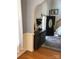 Inviting entryway with hardwood floors, wainscoting, and decorative furniture, leading to the staircase at 1491 Hwy 160 E Rd, Fort Mill, SC 29715
