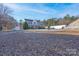 Expansive front yard with mature trees and a large traditional house with ample parking space at 1491 Hwy 160 E Rd, Fort Mill, SC 29715
