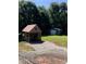 Outdoor storage shed on a spacious lot, with a wooded backdrop and ample parking space at 1491 Hwy 160 E Rd, Fort Mill, SC 29715