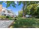 Expansive backyard view showcasing outdoor space, lawn, and additional outdoor buildings at 4016 Nettie Ct, Charlotte, NC 28211