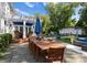 Expansive backyard with a dining table and view of the pool house at 4016 Nettie Ct, Charlotte, NC 28211