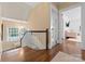 Bright hallway features hardwood floors, staircase, and natural light from the window at 4016 Nettie Ct, Charlotte, NC 28211