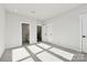 Neutral bedroom featuring carpet, white doors, and ample natural light at 1428 Hamilton St # 13, Charlotte, NC 28206