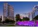 Modern condo towers overlook the city skyline, with a decorative fountain with purple lighting at 1428 Hamilton St # 13, Charlotte, NC 28206