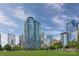 Modern high-rise towers and skyscrapers overlook green spaces on a sunny day in a vibrant cityscape at 1428 Hamilton St # 13, Charlotte, NC 28206