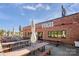 A view of the exterior of the VGBG event space with outdoor seating on a sunny day at 1428 Hamilton St # 13, Charlotte, NC 28206