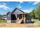New Construction home with a walkout basement and rear deck overlooking the spacious backyard at 213 Sheffield Dr, York, SC 29745