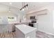 Modern kitchen featuring gray cabinets, stainless steel appliances, and a bright island for functionality at 213 Sheffield Dr, York, SC 29745
