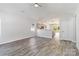 Bright, open-concept living room with modern floors, neutral walls, and seamless flow to the kitchen at 213 Sheffield Dr, York, SC 29745