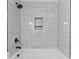 Bathroom showing the tiled shower with a niche and matte black shower head at 213 Sheffield Dr, York, SC 29745
