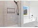 Bathroom featuring a tiled shower and tub combination, plus a built-in niche at 213 Sheffield Dr, York, SC 29745