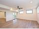 View of the basement featuring light wood floors and windows for ample natural light at 914 Laurel Creek Ln, Charlotte, NC 28211