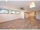 Spacious basement featuring light wood floors, recessed lighting, and windows for ample light and a walk out at 914 Laurel Creek Ln, Charlotte, NC 28211