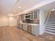 Finished basement with kitchenette, stainless steel appliances and hardwood floors at 914 Laurel Creek Ln, Charlotte, NC 28211