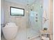 Contemporary bathroom featuring soaking tub and glass shower with natural light at 914 Laurel Creek Ln, Charlotte, NC 28211