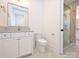 Stylish bathroom featuring glass walk-in shower, gold hardware and tiled floor at 914 Laurel Creek Ln, Charlotte, NC 28211
