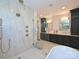 Luxurious bathroom featuring a glass shower, double vanity, and modern fixtures at 914 Laurel Creek Ln, Charlotte, NC 28211
