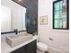 Modern powder room with vessel sink, dark backsplash, and framed window at 914 Laurel Creek Ln, Charlotte, NC 28211