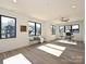 Bright bedroom with hardwood floors, lots of natural light from the windows, and simple furniture at 914 Laurel Creek Ln, Charlotte, NC 28211