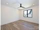 Bright bedroom with hardwood floors, black ceiling fan and contemporary window at 914 Laurel Creek Ln, Charlotte, NC 28211