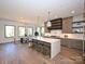 Wide shot of the kitchen and dining area featuring a large island with seating at 914 Laurel Creek Ln, Charlotte, NC 28211