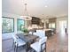 Open-concept kitchen with modern cabinets, stainless steel appliances, and beautiful dining area at 914 Laurel Creek Ln, Charlotte, NC 28211