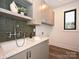 Laundry room with modern fixtures, countertop space and natural light at 914 Laurel Creek Ln, Charlotte, NC 28211
