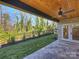 An expansive covered patio extends into the backyard and provides views of the surrounding greenery at 914 Laurel Creek Ln, Charlotte, NC 28211