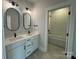 Modern bathroom featuring double sinks, black hardware, and a tiled shower/tub combo at 4314 Morning Mist Dr # 15, Sherrills Ford, NC 28673
