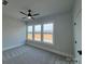 Bedroom featuring plush carpeting, natural light, and three windows with scenic landscape views at 4314 Morning Mist Dr # 15, Sherrills Ford, NC 28673