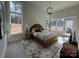 Sunlit bedroom with large windows, stylish light fixture, and contemporary decor at 4314 Morning Mist Dr # 15, Sherrills Ford, NC 28673