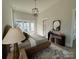 Spacious bedroom with accent rug, modern lighting fixture, and neutral wall colors at 4314 Morning Mist Dr # 15, Sherrills Ford, NC 28673