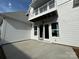 Exterior patio featuring concrete flooring, white siding, and access to the home's interior at 4314 Morning Mist Dr # 15, Sherrills Ford, NC 28673
