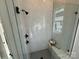 Contemporary shower with white marble tile, black fixtures, and a built-in bench at 4314 Morning Mist Dr # 15, Sherrills Ford, NC 28673