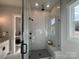 Modern shower with glass enclosure, rain shower head, and mosaic tile flooring at 4314 Morning Mist Dr # 15, Sherrills Ford, NC 28673