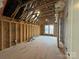 Unfinished room showing framing, electrical wiring, and bare wood floors at 4314 Morning Mist Dr # 15, Sherrills Ford, NC 28673