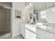 Modern bathroom with double sinks, granite countertops, and a tiled shower at 1015 Kokomo Ln # 22, Charlotte, NC 28206