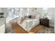 Comfortable bedroom featuring neutral tones, a cozy rug, and lots of natural light at 1015 Kokomo Ln # 22, Charlotte, NC 28206