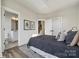 Bright bedroom featuring a view of the bathroom, stairs, and modern decor at 1015 Kokomo Ln # 22, Charlotte, NC 28206