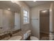 Bathroom with granite vanity and access to attic storage at 317 Blackburn St, York, SC 29745