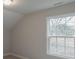 Bright bedroom with large window and neutral walls at 317 Blackburn St # 4, York, SC 29745