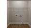 Small laundry closet with wire shelving and hookups at 317 Blackburn St # 4, York, SC 29745