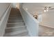 Carpeted staircase leading to the upper level at 317 Blackburn St # 4, York, SC 29745